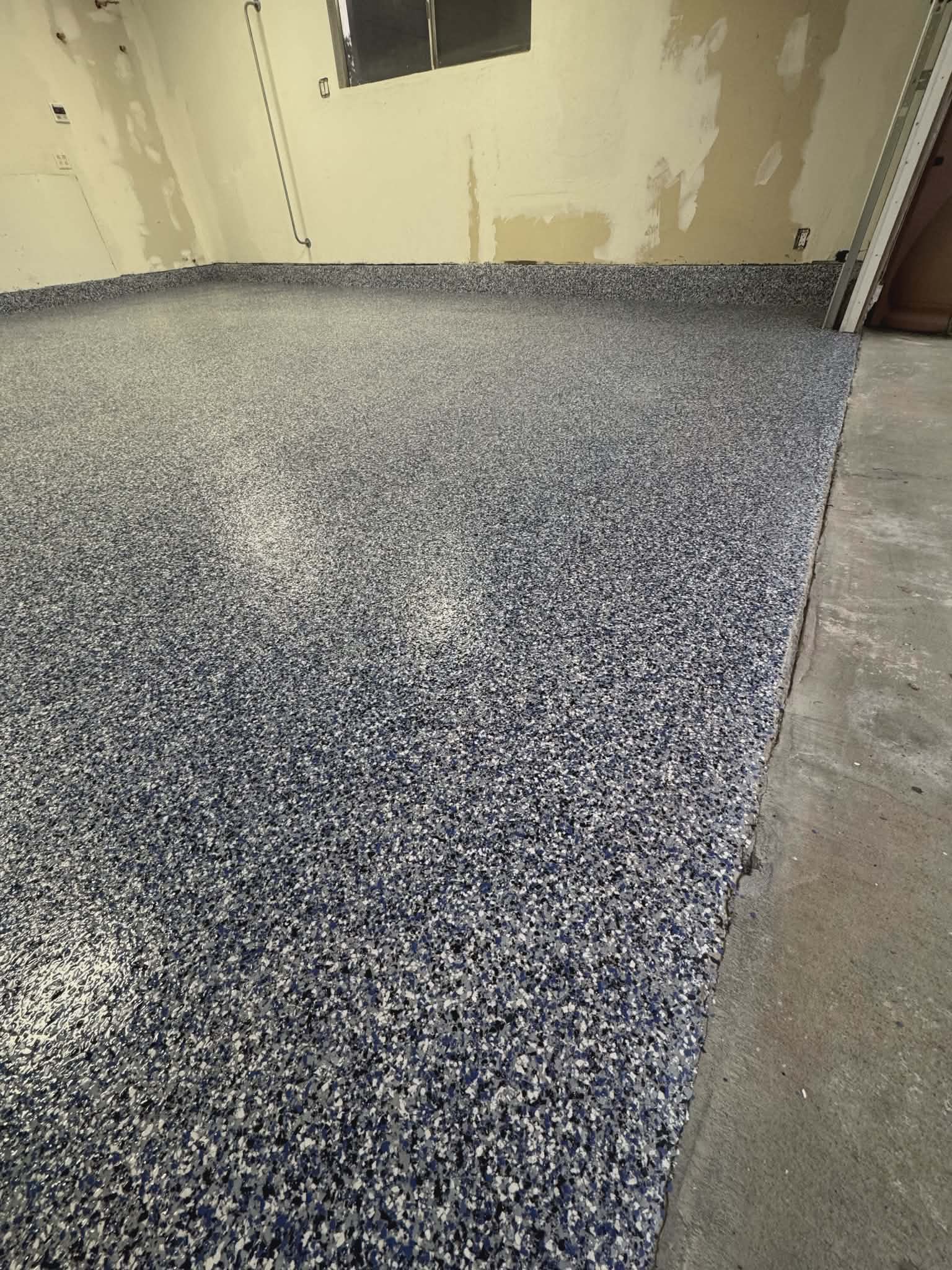 Blue flake epoxy garage floor coating, detail view