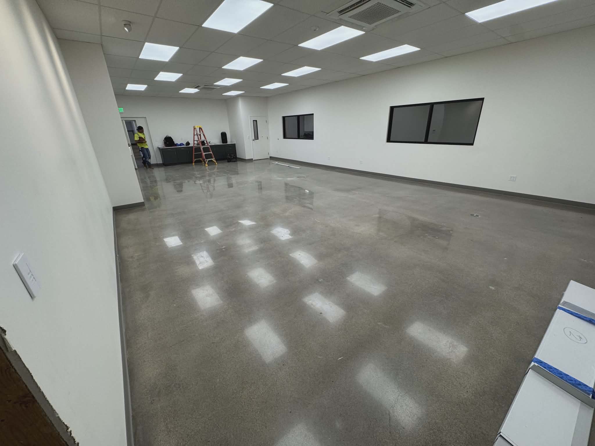 High-gloss epoxy floor in commercial office space showing reflective finish