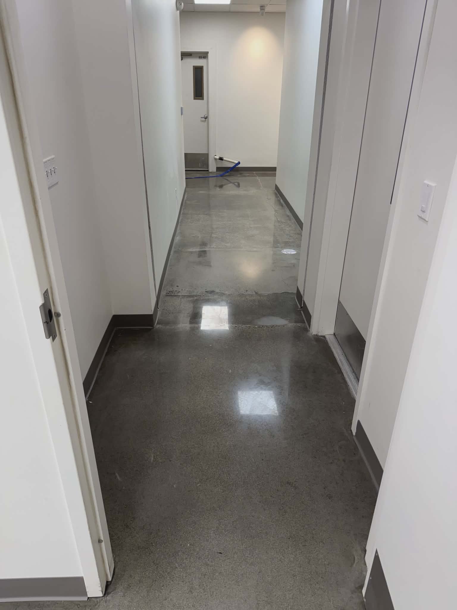 Decorative epoxy floor coating in a commercial office hallway